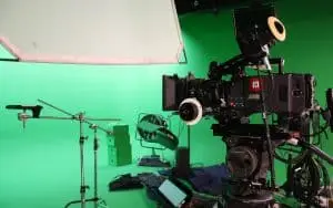 ARRI Alexa camera in foreground with film equipment, studio and greenscreen in background for U2 Tour video shoot managed by Films.Solutions