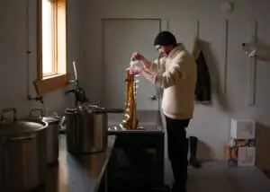 Terrence cleaning seaweed in his preparation room, where it will be transformed into beauty products