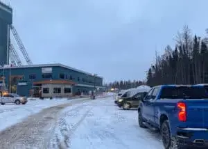Blue truck parked at LaRonde Mine's main administration building.