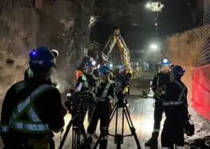 Filming crew capturing hydraulic jackhammer operations 3km below the surface.