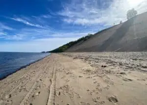 Peaceful view from the bottom of a large dune in Tadoussac, with the Saint-Laurent River in the background